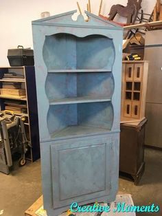 an old blue bookcase in a shop