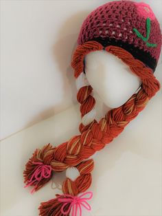 a crocheted hat and scarf on top of a mannequin's head