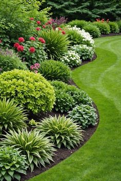 a garden with lots of green grass and flowers