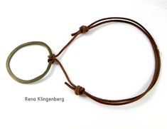 a brown cord with a ring on it