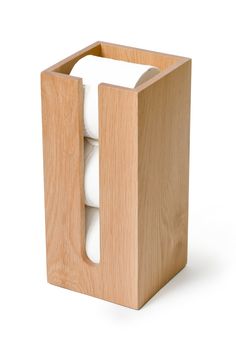 a wooden box with two rolls of toilet paper in it and one roll sticking out of the top