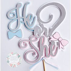 a cake topper that says hello and she is next to the word's name