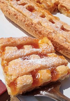 two pieces of pie sitting on top of a white plate