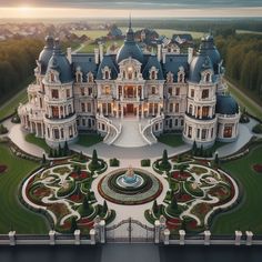 an aerial view of a large mansion with many windows and gardens on the front lawn