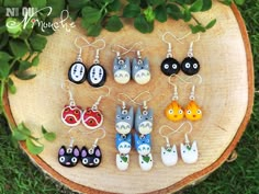 six pairs of earrings with cartoon characters on them