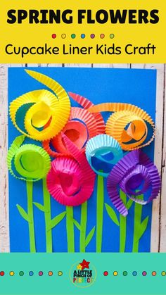 paper flowers made from cupcake liners on a blue background with the words spring flowers