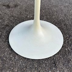 an image of a white pedestal on the ground