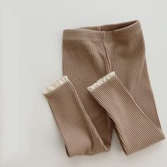 These rib-knit leggings are a must-have wardrobe essential for your baby girl. Made of soft cotton for everyday wear, these leggings fit snugly on your little one's legs to keep her warm and cosy. Ribbed texture complements any outfit and keeps the baby looking stylish. Material: Cotton Suggested Size Suggested age Waist*2 Pants Length Fly Length Inch cm Inch cm Inch cm 66 6M 7.5 19 15.7 40 7.5 19 73 9M 7.9 20 17.7 45 8.7 22 80 12M 8.3 21 19.3 49 9.4 24 90 24M 8.7 22 20.1 51 10.2 26 *Please allo Toddler Bottoms, Ruffle Leggings, Lace Leggings, Lace Cuffs, Ribbed Leggings, Baby Leggings, Knit Leggings