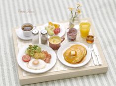 there is a tray with breakfast foods on it