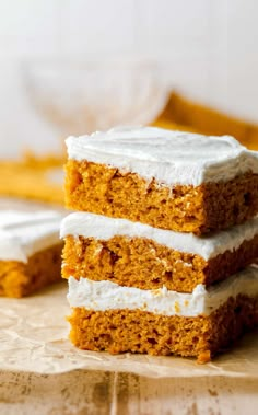 three pieces of carrot cake with white frosting