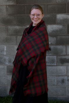 The brown and red plaid, Canadian Maple Leaf tartan blanket scarf can be added to the winter coat you have or wear it to top off that sweater you feel so comfortable in. It makes a great over-sized scarf gift for that special lady on your list. Cozy up your room my tossing this across your favorite chair as a throw. This scarf is made of the same Maple Leaf tartan pattern that the Duchess of Cambridge wore in Canada. More recently Princess Kate wore it on their Royal Tour. Be practical and wear Scottish Plaid Winter Scarf, Fall Plaid Shawl Scarf, Plaid Shawl Scarf For Fall, Tartan Blanket Scarf, Tartan Shawl, Air Force Families, Leaf Blanket, Canadian Maple Leaf, Tartan Plaid Scarf