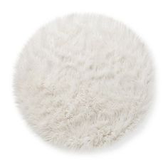 a round white area rug on a white background