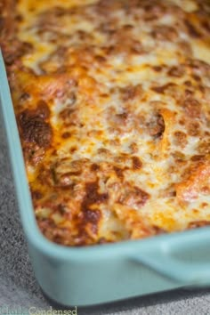 a casserole dish with cheese and meat in it