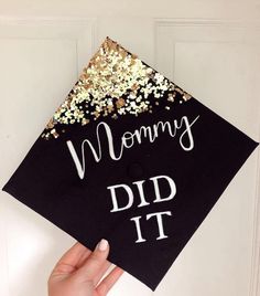 a graduation cap with the words mommy did it written on it and gold confetti