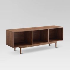 the sideboard is made out of wood and has three compartments on each side, one with