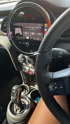 the interior of a car with steering wheel controls