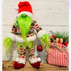 an image of a christmas decoration with green hair and griny face on the shelf