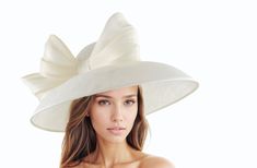 Ivory Off White Ecru Kentucky Derby Hats Ascot Church Race Day Tea Garden Party Wide Brim Wedding Formal Occasion Woman Bow Ivory Off White Saskia Large Formal Ascot Hat for Kentucky Derby Church Weddings Classic Audrey Hepburn style Dome Down Turned wide brimmed sinamay hat trimmed with abacca silk trim The brim on the Saskia formal hat measures 41 cm side to side with a crown height of 11cm The Saskia hat has an inside circumference is 58cm.  Looking for the perfect accessory for your next eve Feminine Hats For Wedding And Royal Ascot, Cream Wide Brim Wedding Hat, Cream Wide Brim Hat For Wedding, Cream Wedding Hats For Spring, Chic Cream Wedding Hat, Beige Hat For Wedding At Royal Ascot, Elegant Cream Hat For Garden Party, Chic Beige Wedding Hat, Cream Wedding Hat For Summer