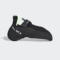 a black shoe with neon green accents