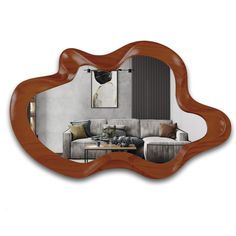 a mirror that is reflecting a couch and table in front of the mirror, with an image of a living room behind it