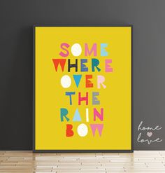 some where over the rainbow bow on a yellow background in a room with grey walls