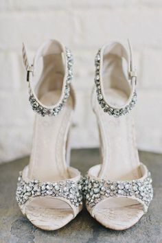 a pair of white shoes sitting on top of a table