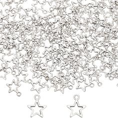 many small silver stars on a white background