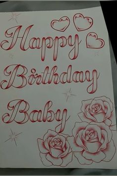 a happy birthday card with roses and hearts on the front is written in red ink