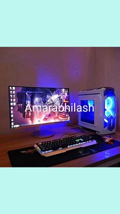 a desktop computer sitting on top of a wooden desk next to a keyboard and mouse