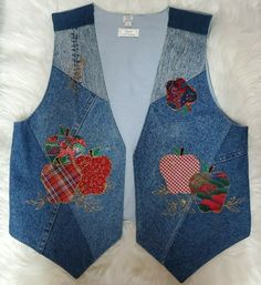 the back of a jean vest with patchwork and appliqued apples on it