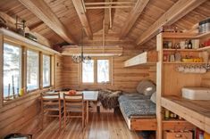 a room with wooden walls and flooring in it