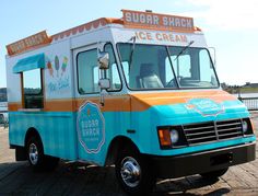 an ice cream truck is parked on the dock