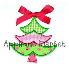 an applique christmas tree with pink and green polka dots on the bottom, red bow at the top