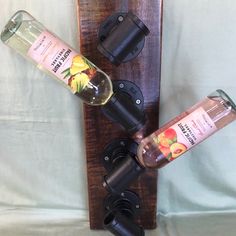 two bottles are sitting on top of a bottle holder