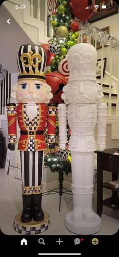 two large nutcrackers are standing next to each other