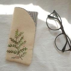 a pair of glasses sitting on top of a towel