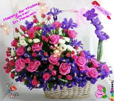 a basket filled with lots of pink and purple flowers