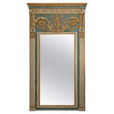 an ornate mirror is hanging on the wall