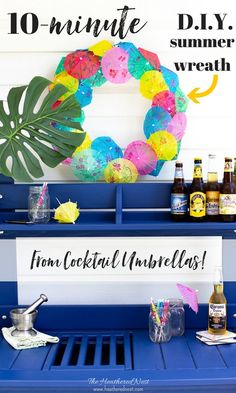 an outdoor bar with drinks and decorations on the top, next to a sign that reads 10 - minute diy summer wreath