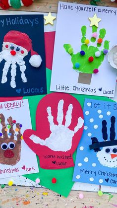 handprinted christmas cards are displayed on a table