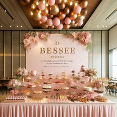 the dessert table is decorated with pink and gold decorations