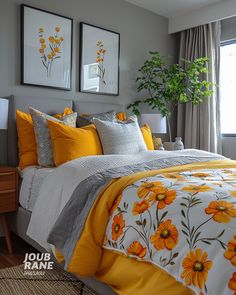 a bedroom with yellow and gray bedding, two pictures on the wall above the bed