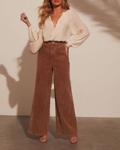 Introducing the Sophia Wide Leg Pants—where romance meets effortless chic. Made from luxe corduroy, these pants drape beautifully with their wide-leg silhouette, offering a blend of sophistication and comfort. The classic 5-pocket styling adds a practical touch while maintaining a polished look. Pair with a delicate blouse for a refined day look or dress up with a statement top for evening allure. Runs large, consider sizing down Corduroy fabric 5-pocket styling Zip fly with button closure 75% C How To Style Corduroy Pants, Brown Wide Leg Pants Outfit, Orange Pants Outfit, Madewell Outfits, Brown Pants Outfit, Corduroy Pants Outfit, Wide Leg Pants Outfit, Daisy Jones, Fall Pants