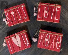 three valentine's day decorations made out of red books with the words kiss, i love and xoxo written on them