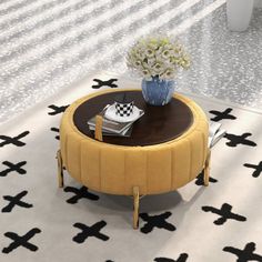 a coffee table with a flower vase on top of it in front of a white and black rug