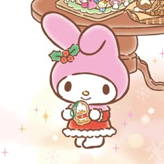 a hello kitty cartoon holding an egg in front of a table