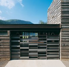 a garage door with the word alcove on it in front of a building