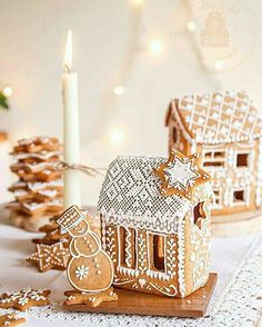 gingerbread houses are decorated with icing and snowflakes