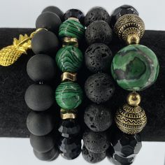 Southern Charmed Stack Bracelets are proudly handcrafted by a Florida educator.  This set features green malachite, black lava stone, and black matte and iridescent glass Czech beads on elastic cord, easily fitting wrists 6-8 inches (may be customized for other lengths--please leave note in comments when purchasing). Luxury Festive Beads For Gifts, Bracelets Layered, Lava Stone Jewelry, African Beaded Bracelets, Beads Gifts, Stacked Beaded Bracelets, Stack Bracelets, Green Beaded Bracelets, Malachite Bracelet