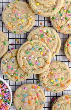 several cookies with sprinkles on a cooling rack